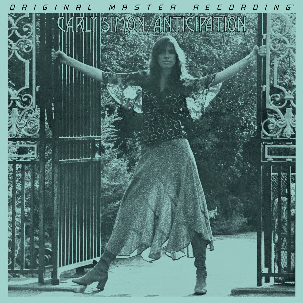 Album cover with a person standing between two gates, text at the top