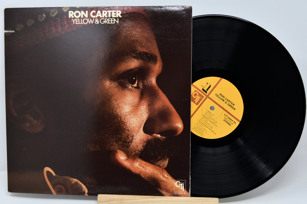 Vinyl record and cover of 'Yellow & Green' by Ron Carter on a light blue background