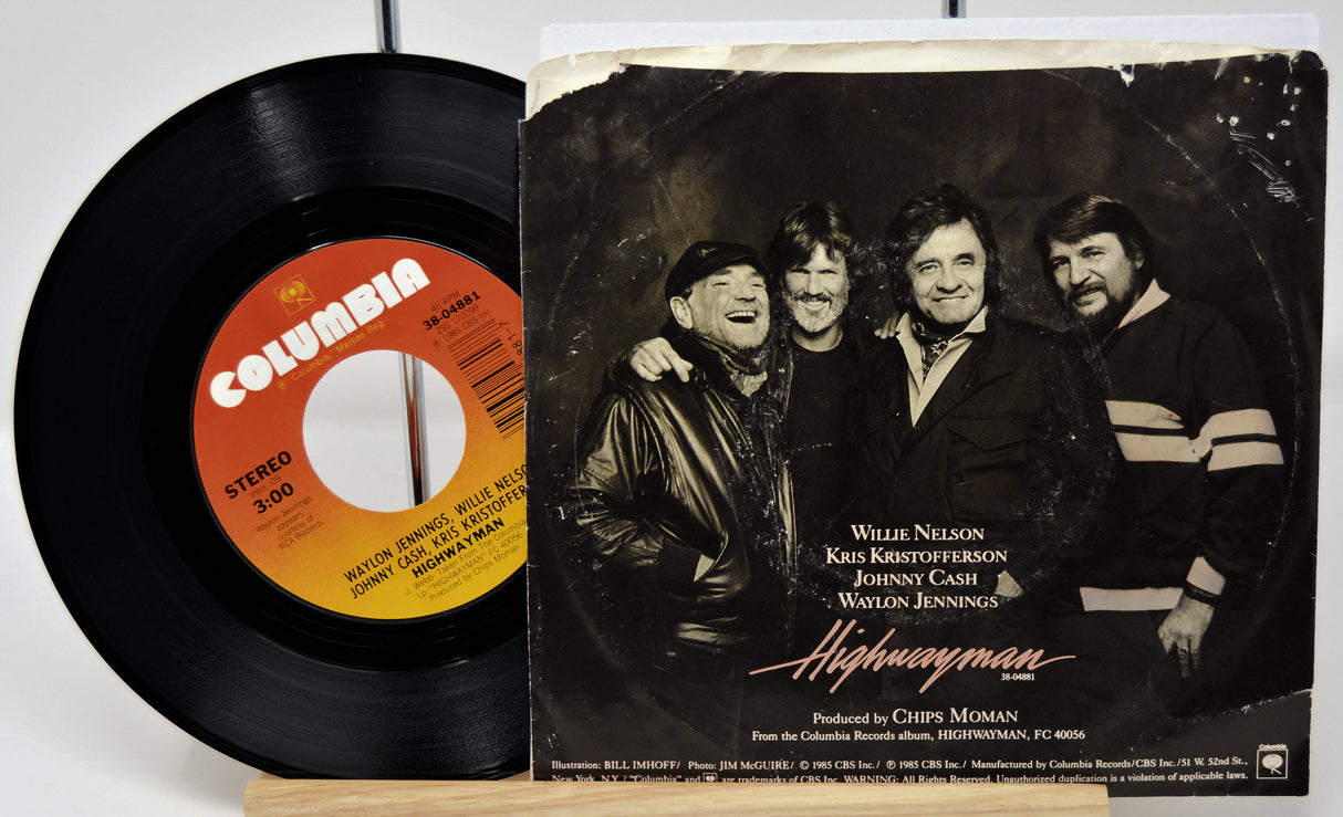 Vinyl record with Columbia label and album cover featuring four men, likely a band, on a white background.