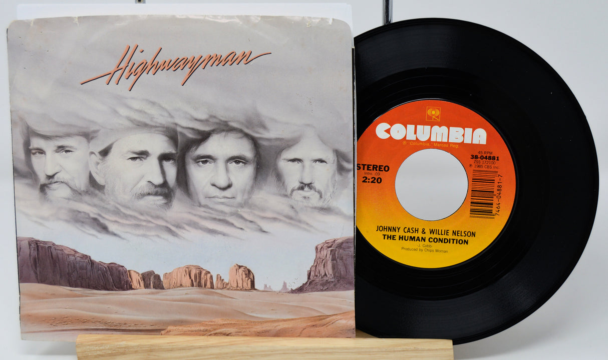 Vinyl record and cover titled 'Highwayman' by Johnny Cash and Willie Nelson on a white background.