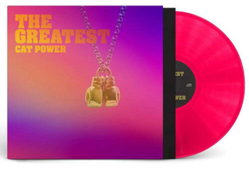 Vinyl record with a necklace on top against a gradient background