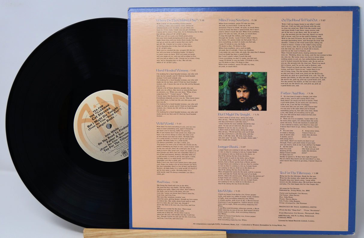 Vinyl record with cover displaying text and a photo of a person.