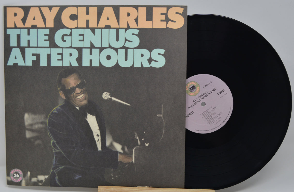 Vinyl record with 'Ray Charles The Genius After Hours' cover showing a musician with sunglasses.