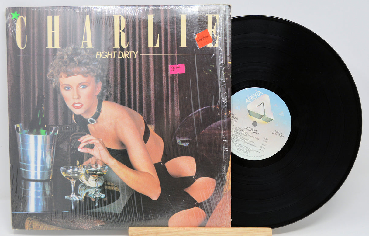Vinyl record by Charlie titled Fight Dirty with front cover featuring a woman leaning over a bar.