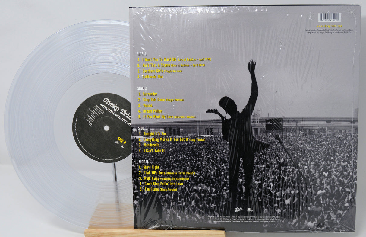 Vinyl record with a clear disc and cover featuring a silhouette of a person at a concert.