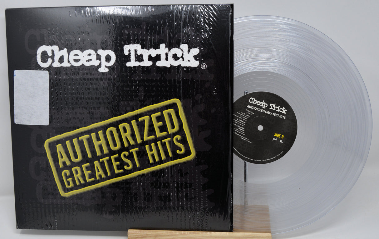 Vinyl record with 'Cheap Trick' album cover featuring clear record and black cover.