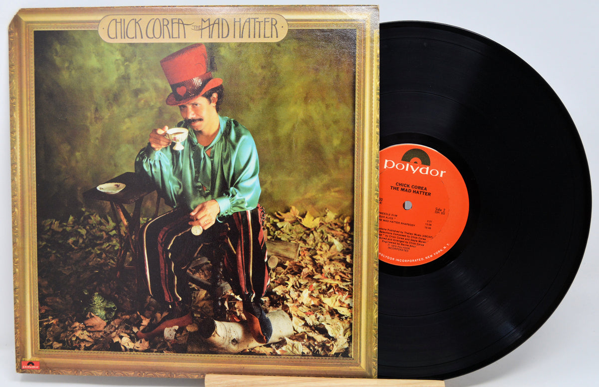 Chuck Close's 'Paid Father' vinyl record LP with its illustrated cover jacket and black record partially pulled out, photographed against a light neutral background.