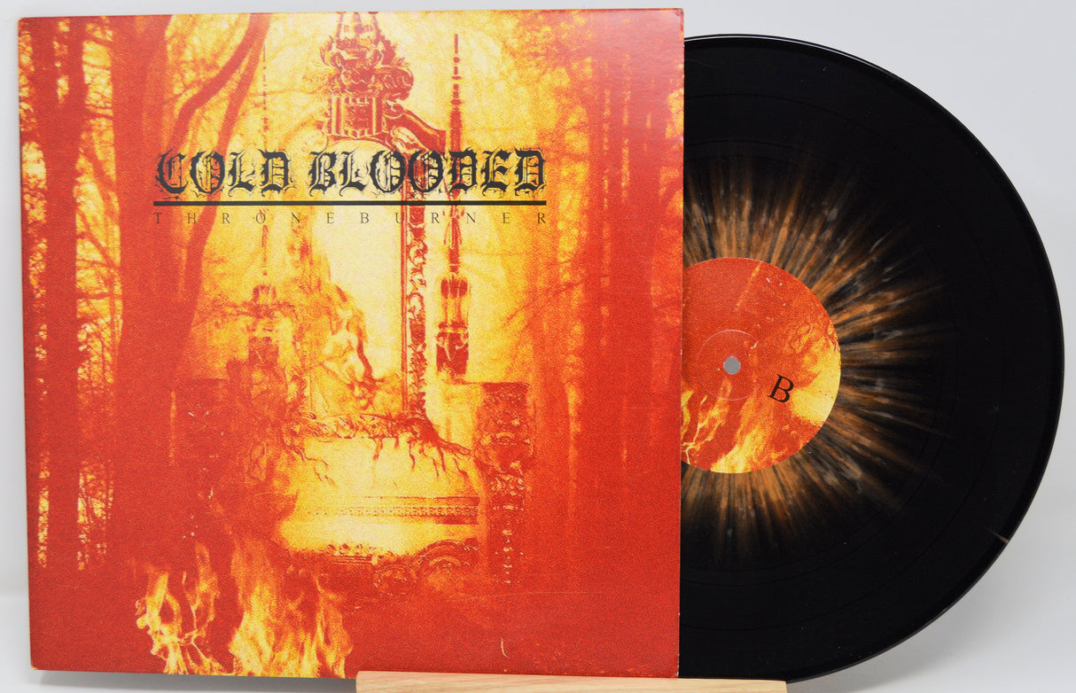 Vinyl record with a red and orange album cover featuring text 'Cold Blooded'.
