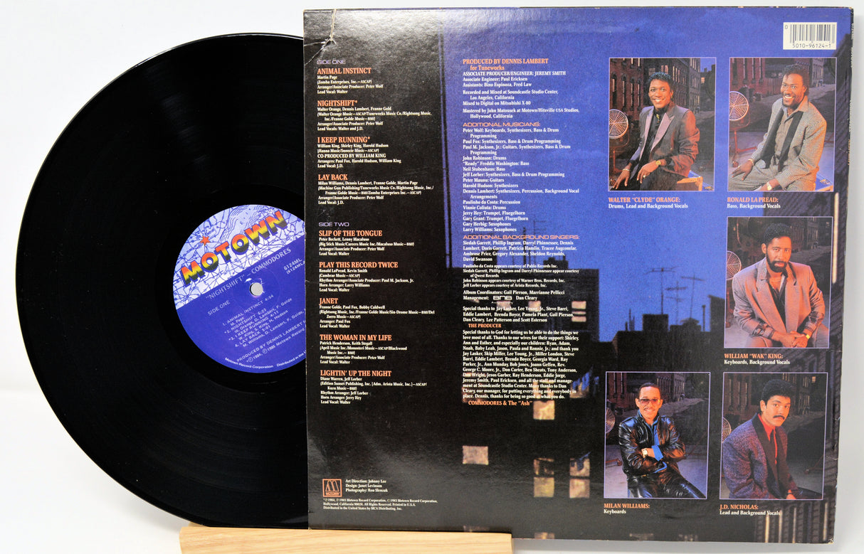 Vinyl record with its cover displaying text and images of a person.