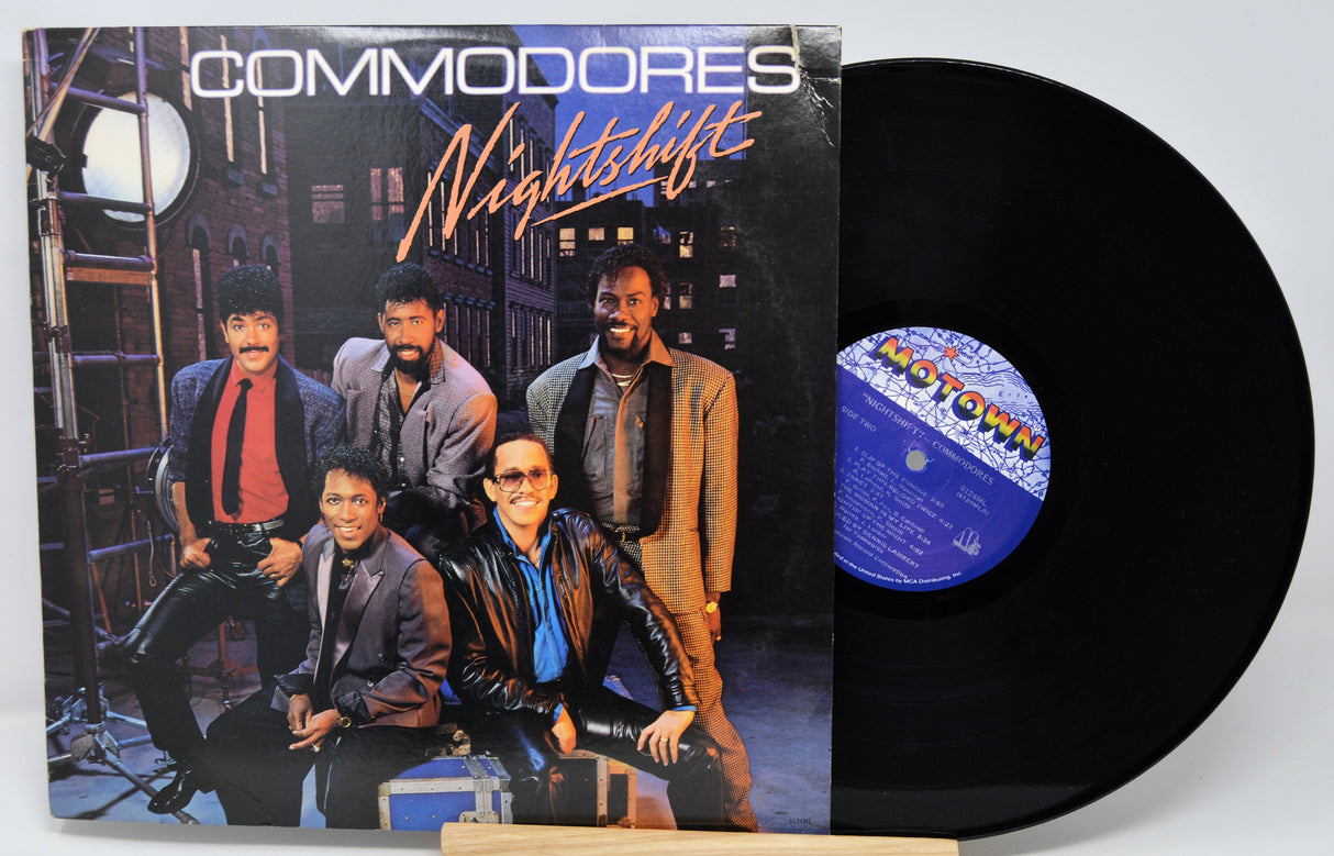 Vinyl record with cover featuring a group of people and the title 'Nightshift' by Commodores.