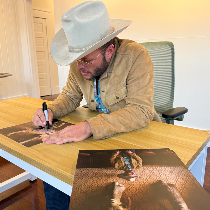 A picture of Charley Crocket signing inserts that will be used for this release.