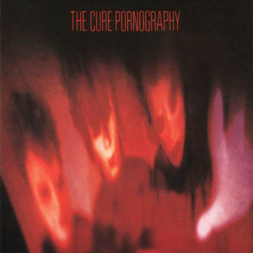This image features the album cover of "Pornography" by The Cure, a iconic album released in 1982. The artwork is strikingly dark and moody, depicting blurred, fiery red and black images that evoke a sense of emotional intensity and turbulence.