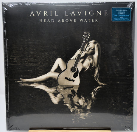 Album cover of 'Head Above Water' by Avril Lavigne with a person holding a guitar underwater.