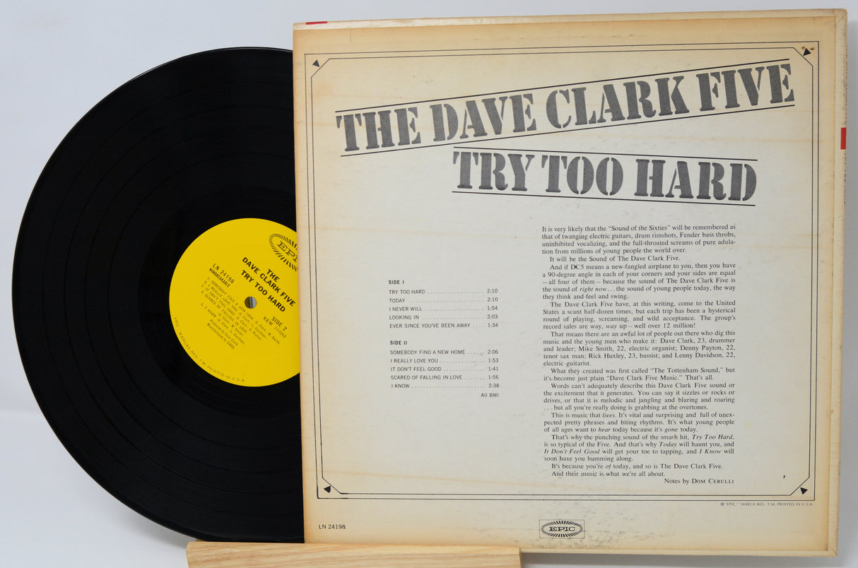 Vinyl record with 'The Dave Clark Five Try Too Hard' cover on a light gray background