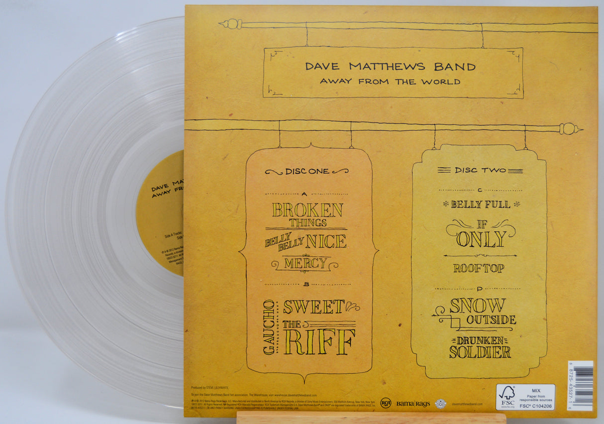 Dave Matthews Band 'Away From The World' vinyl record LP shown with the back cover in yellow and a translucent clear vinyl record partially visible on the left.