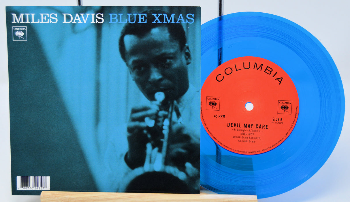 Vinyl record with blue cover and red label featuring Miles Davis' 'Blue Xmas'.