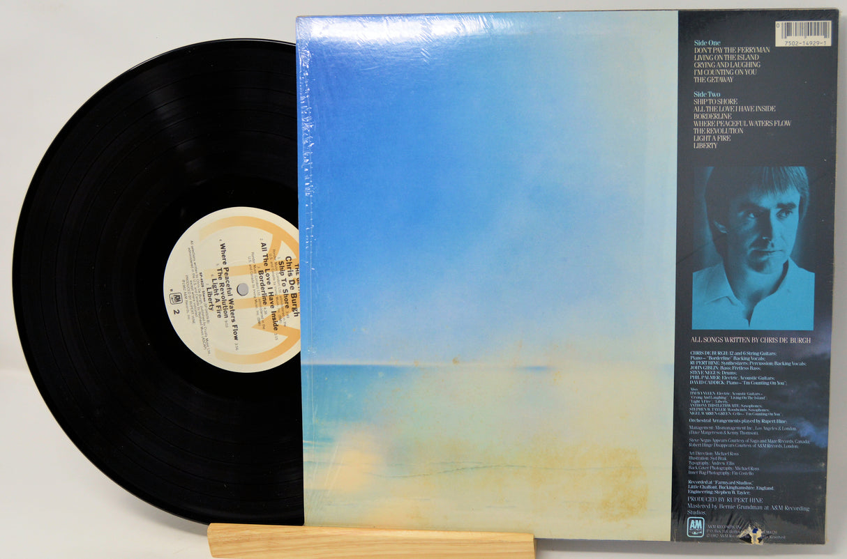 Vinyl record with cover featuring a blue gradient and text