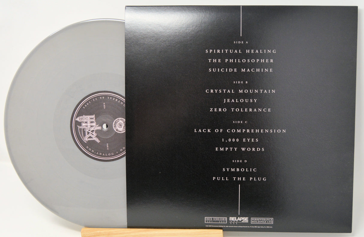 Back cover and grey vinyl record of Death – Non:Analog On:Stage Series Montreal 1995, showing tracklist