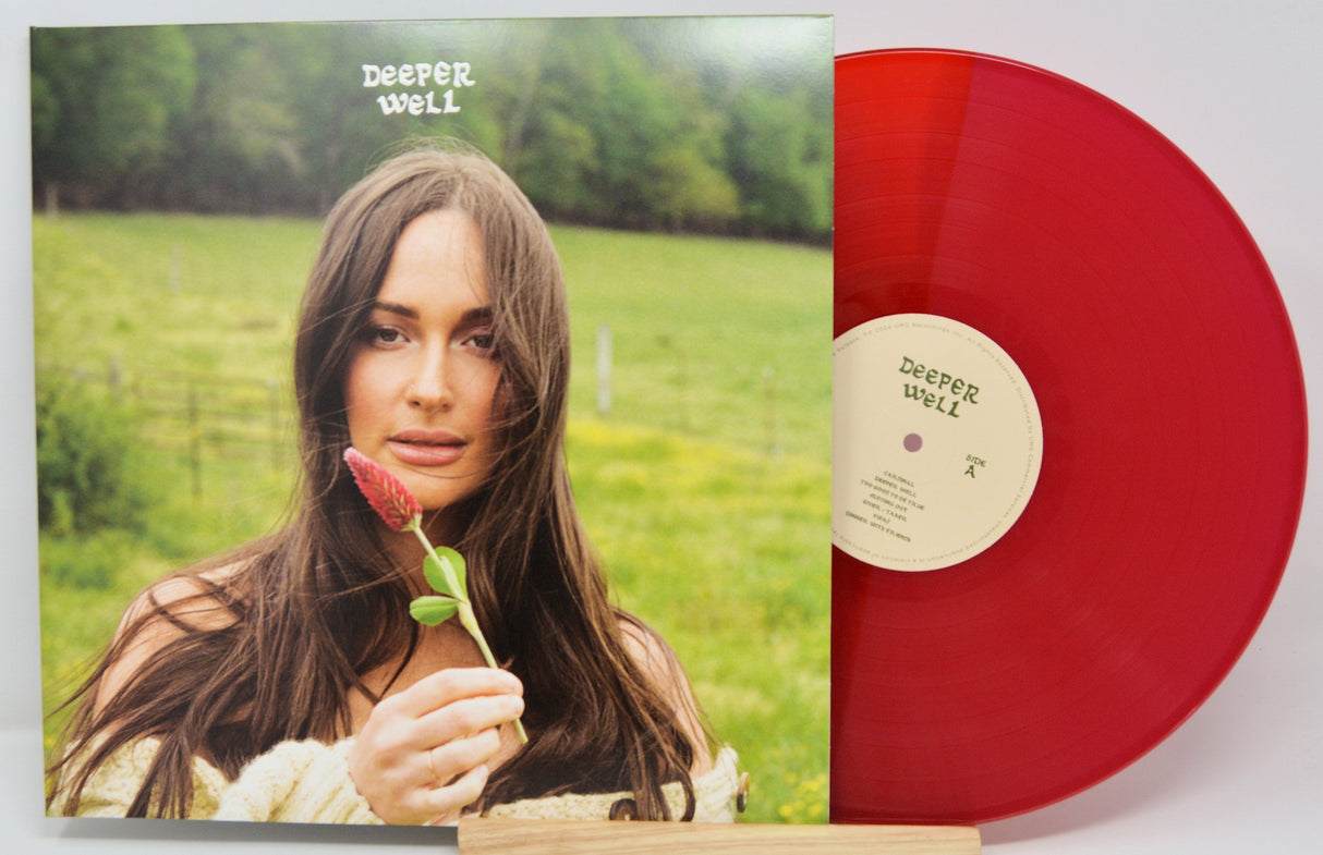 Deeper Well album cover with woman holding a red flower, alongside the limited edition red vinyl record