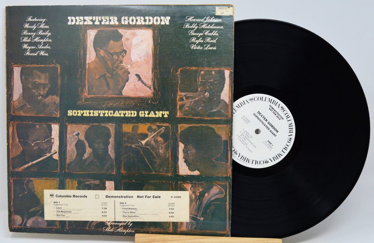 Dexter Gordon's 'Sophisticated Giant' vinyl record album with the LP disc partially pulled from the jacket, photographed against a light gray background.