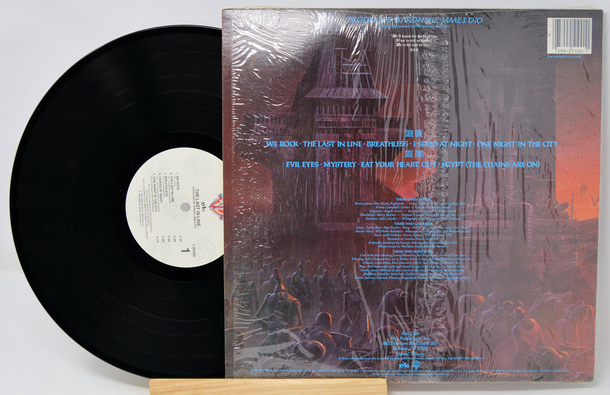 Vinyl record with cover featuring abstract design and text