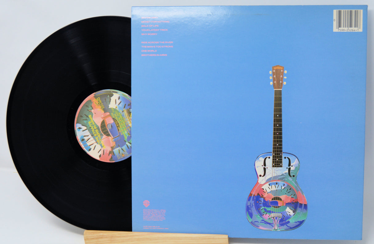 Vinyl record with a colorful guitar illustration on the cover