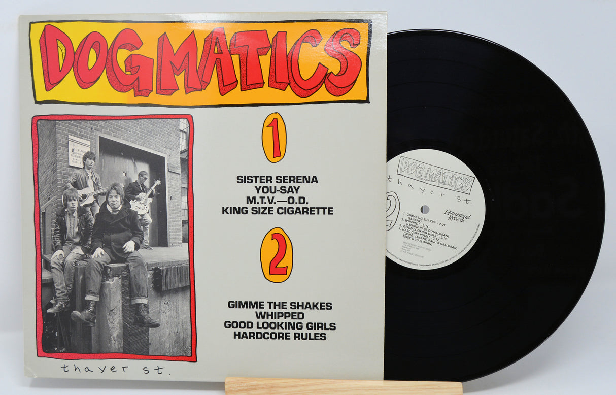 Used vinyl record of Dogmatics with record label and tracklisting on the cover.