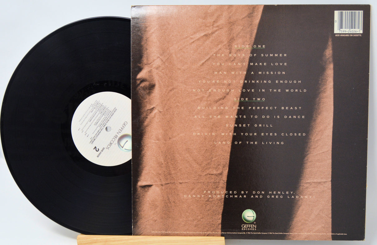 Vinyl record with a brown textured cover and white label on a light gray background
