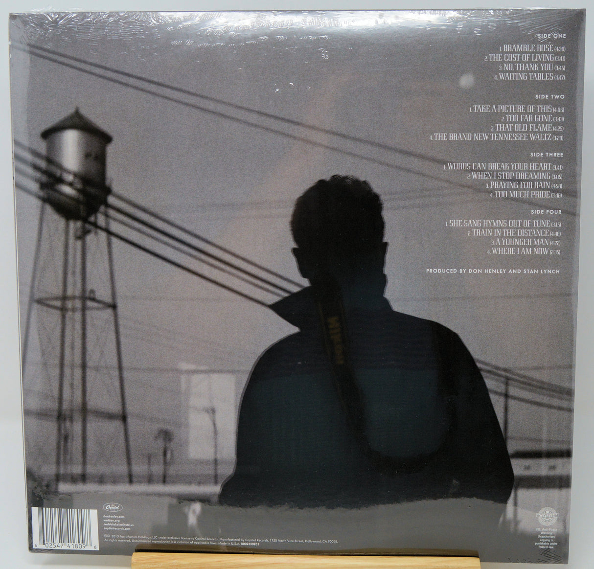 Back cover of a vinyl record sleeve for Timbaland's album 'This Is What I Want', showing a grayscale photo of a person from behind in front of a water tower, with tracklist text on the right.