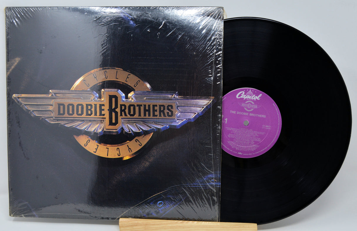 Vinyl record with cover featuring the Doobie Brothers logo on a white background