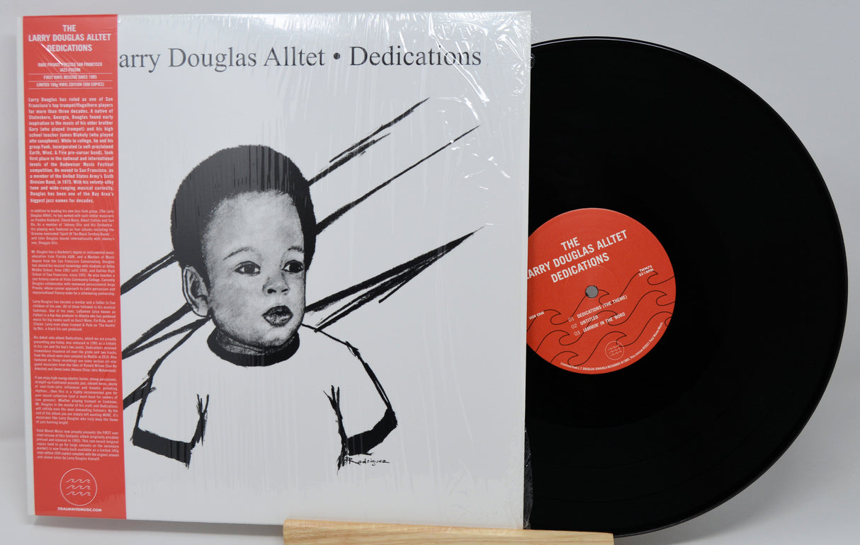 Vinyl record with cover featuring a stylized illustration of a child and text.