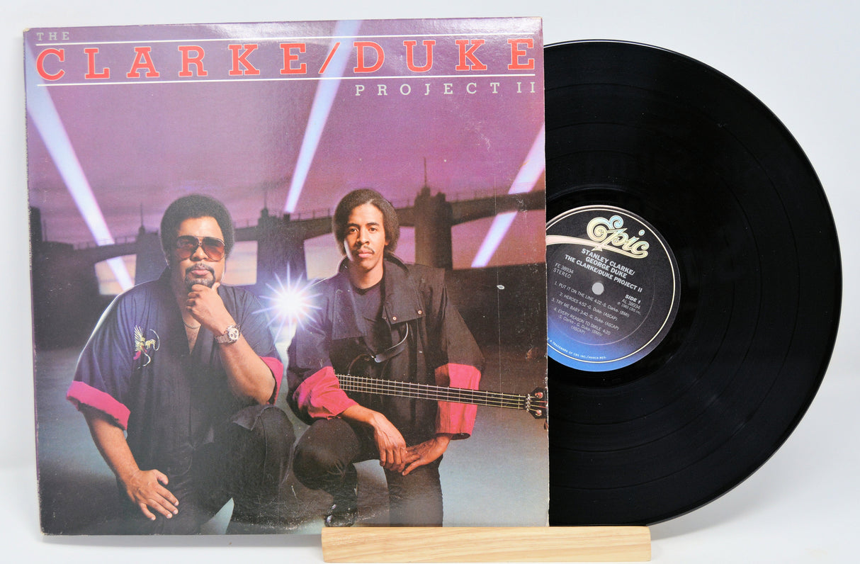 Front cover of Clarke/Duke Project II showing Stanley Clarke & George Duke with their instruments and vinyl record