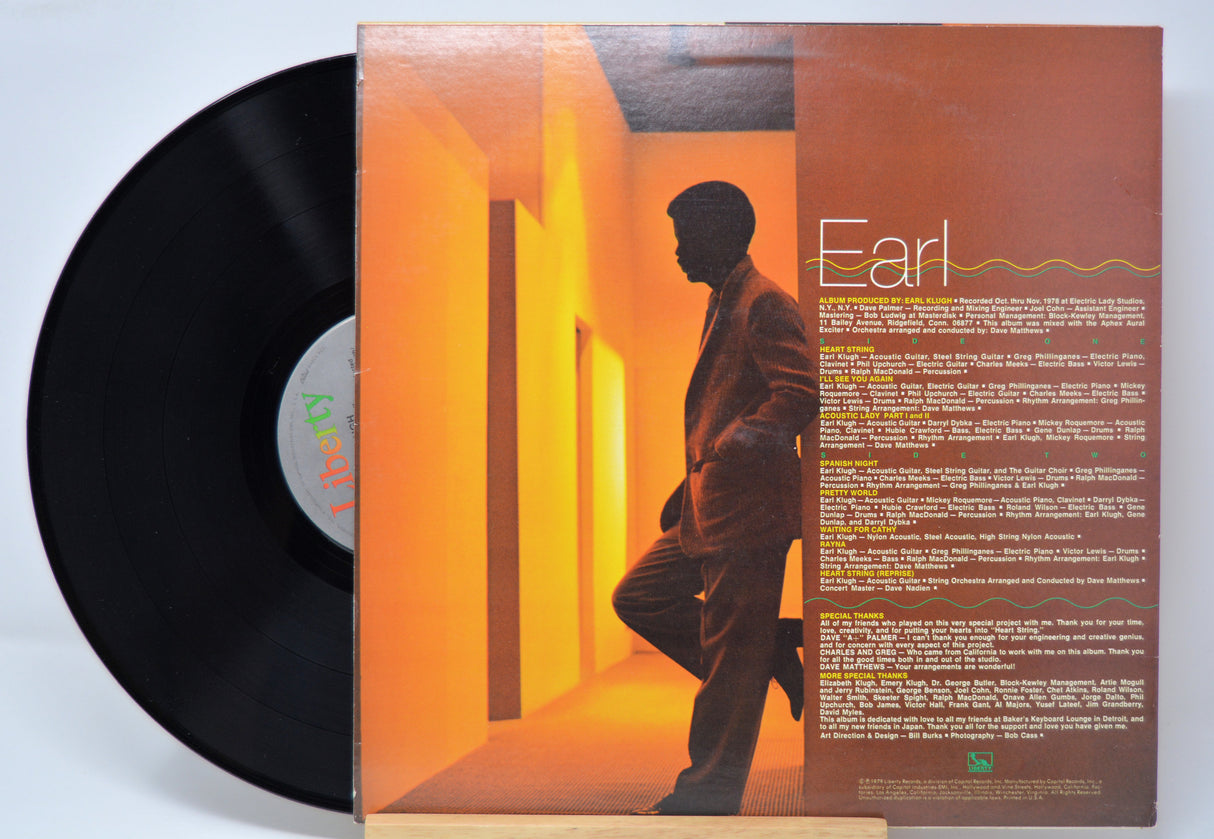'Earl Klugh Heart String' Vinyl record with a cover featuring a silhouette of him and text on a light blue background