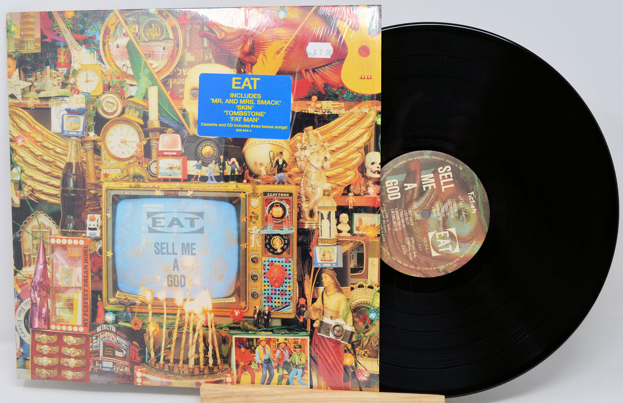 Vinyl record with colorful cover featuring text and graphics