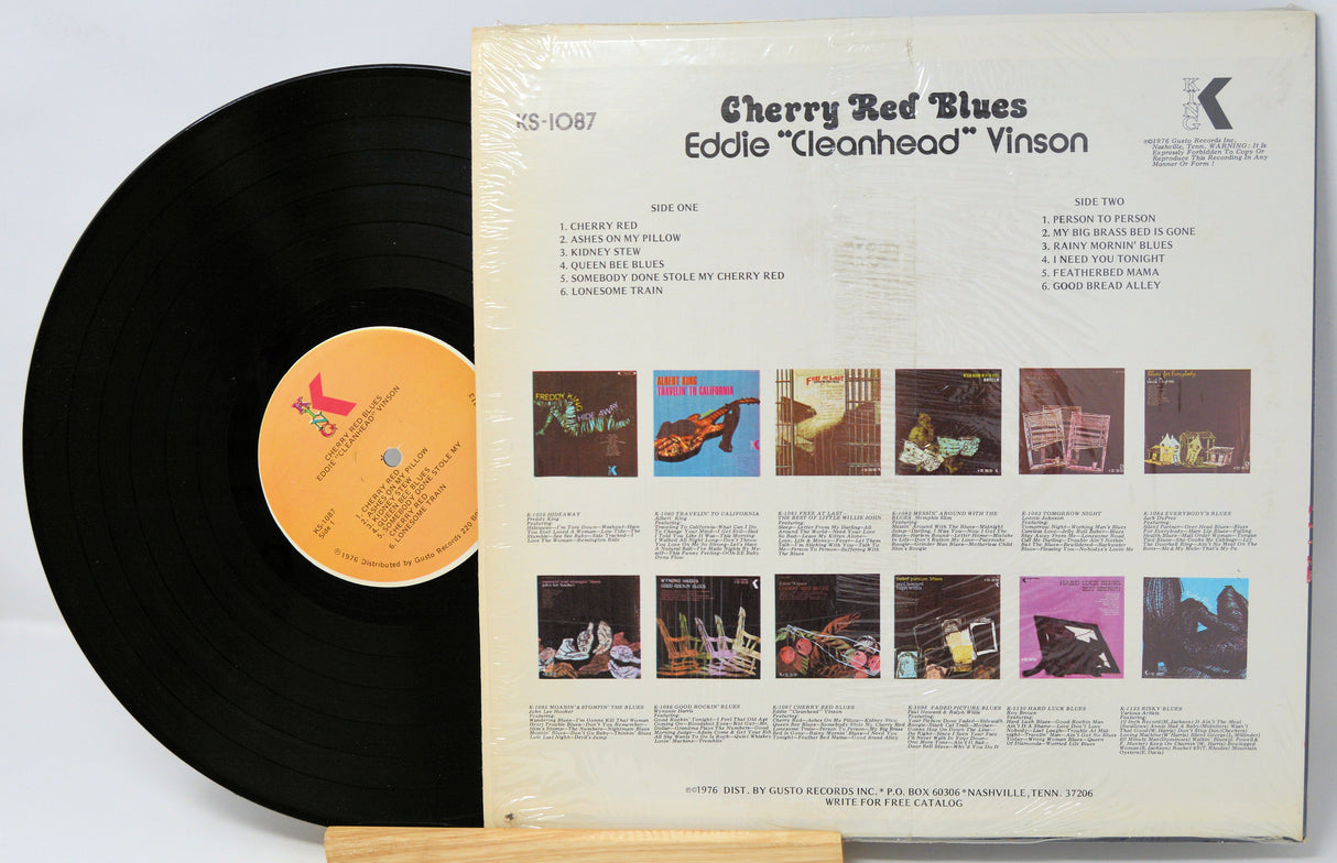 Vinyl record with cover displaying album art and text