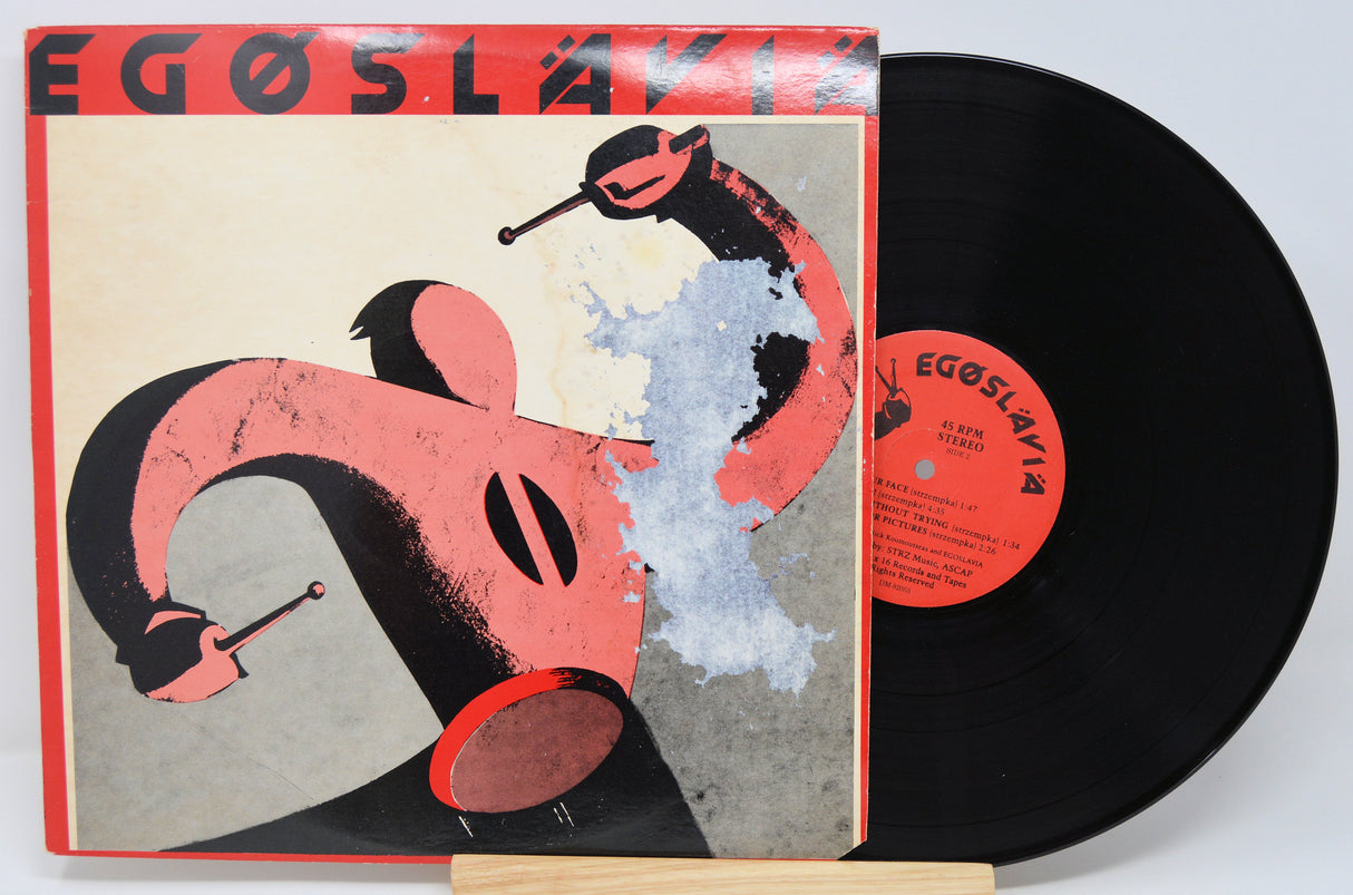 Vinyl record with a colorful cover featuring abstract art and 'Egoslavia' text.