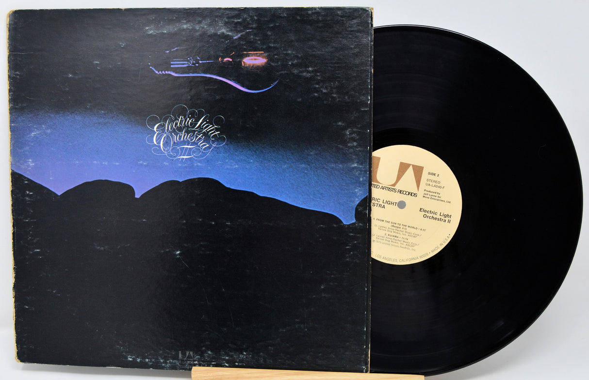 Vinyl record with cover featuring a mountain landscape and 'Electric Light Orchestra' branding.