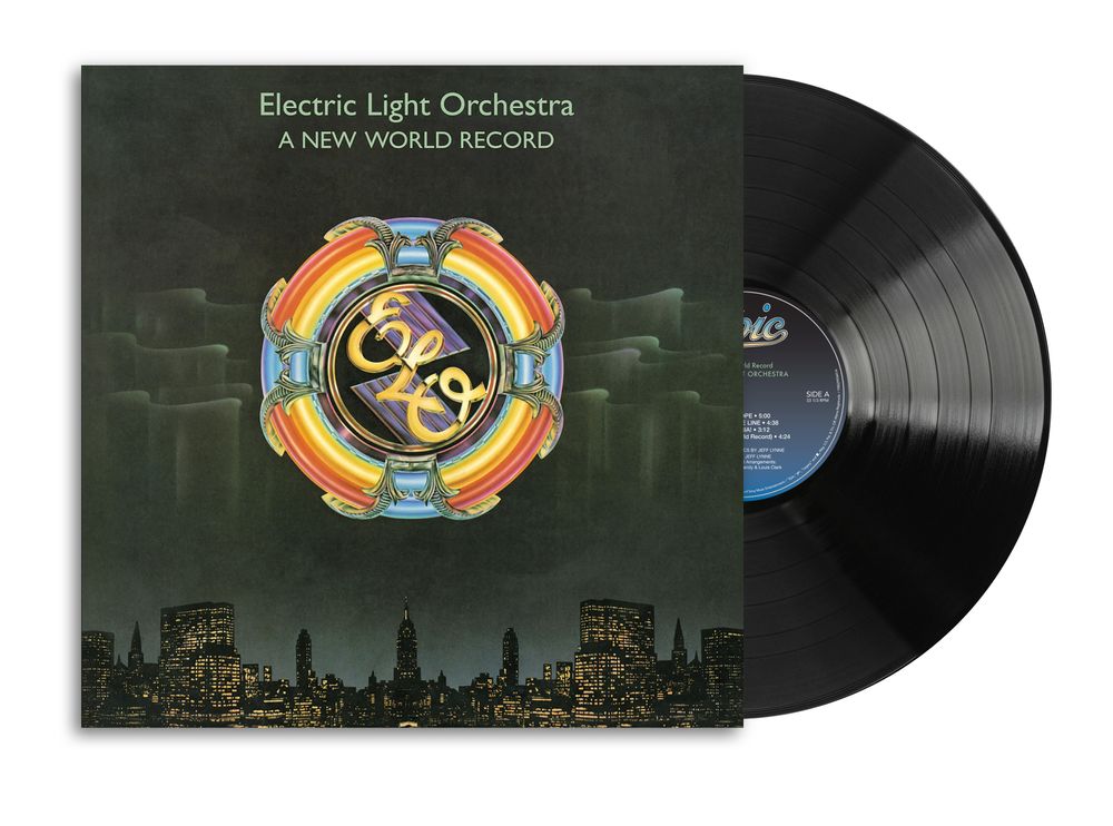 Electric Light Orchestra - A New World Record vinyl record with the album cover in front and the black LP partially visible behind it on a white background.