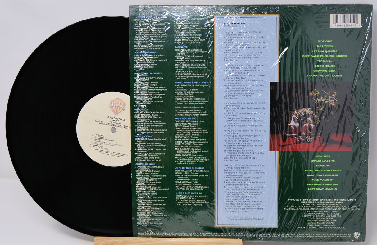 Vinyl record with its cover showing text and a small image of a couple.