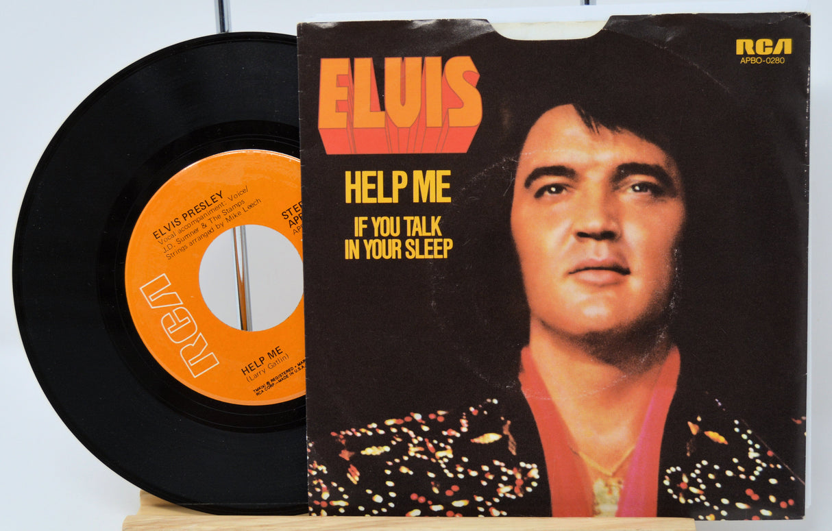 Elvis Presley RCA 45 RPM single with cover featuring 'Help Me' and 'If You Talk In Your Sleep'