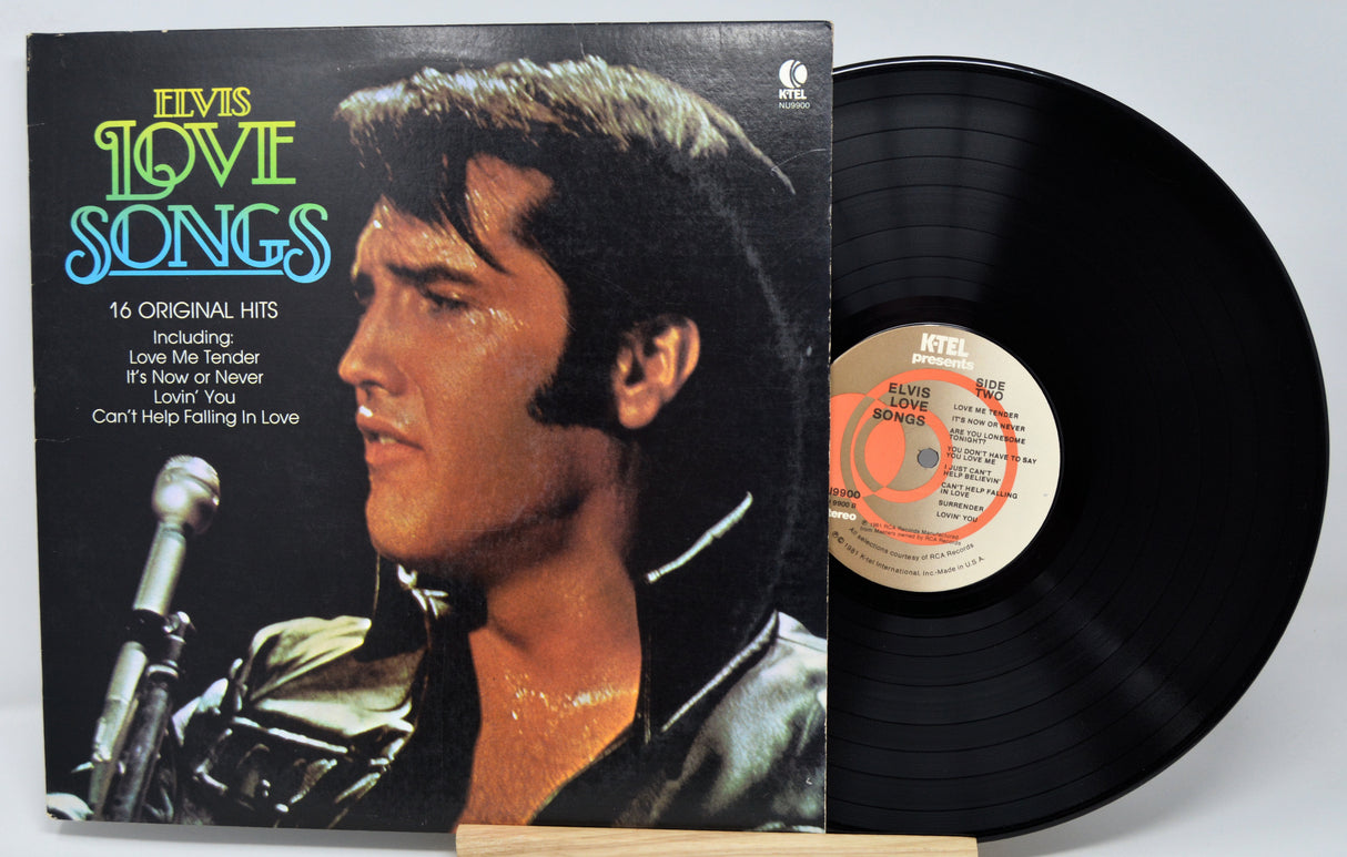 Vinyl record with cover featuring Elvis Presley and album details on a white background