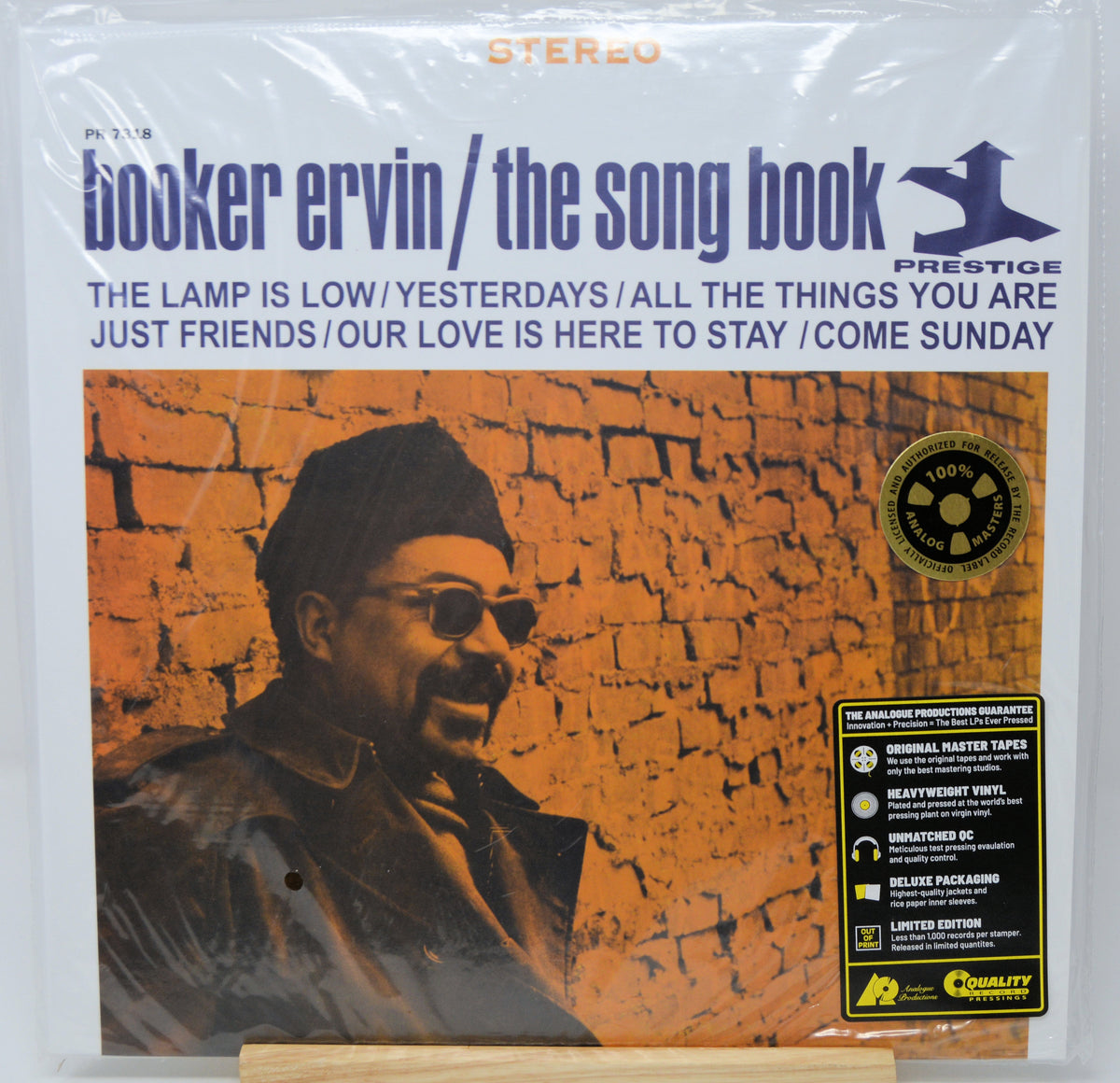 Booker Ervin 'The Song Book' vinyl record LP on a white background, sealed in plastic. The cover features a portrait of Booker Ervin against an orange brick wall, with blue title text and a black Prestige logo.
