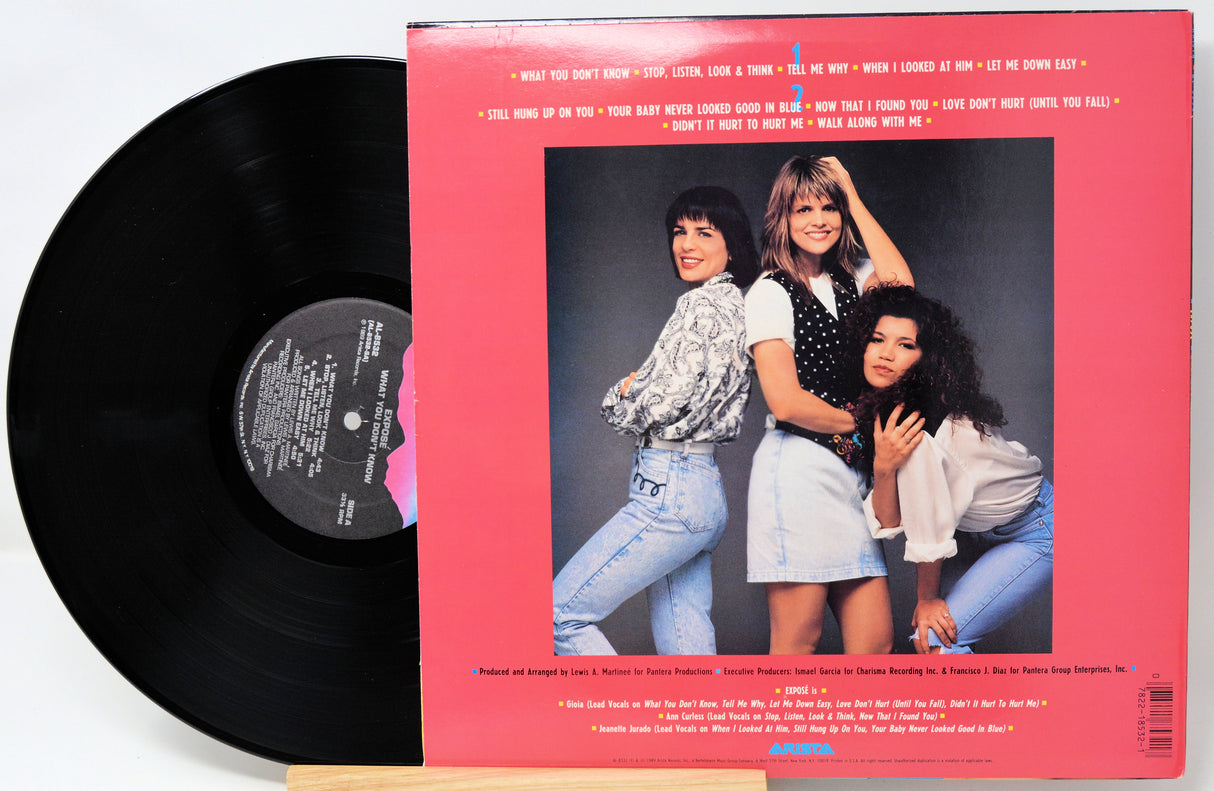 Vinyl record with a pink cover featuring three women and text.