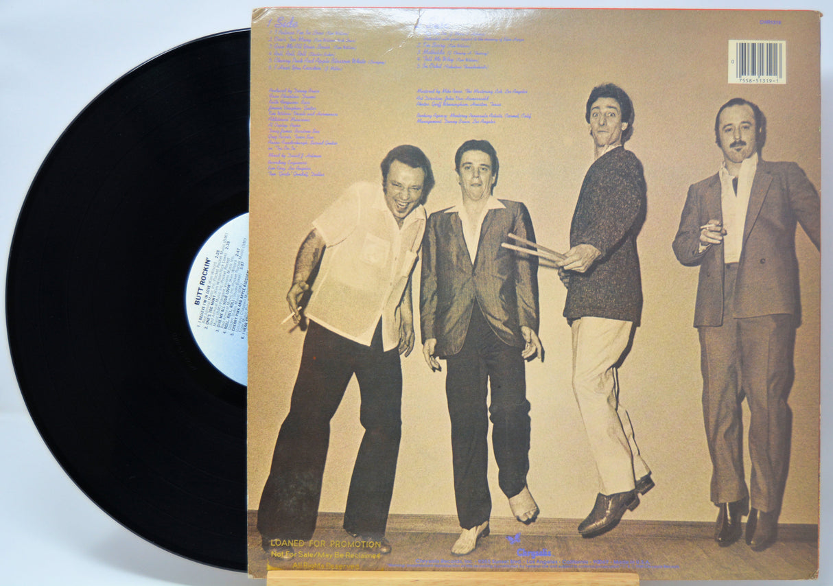 'Fabulous Thunderbirds Butt Rockin' Vinyl record with a cover featuring the band in suits on a beige background