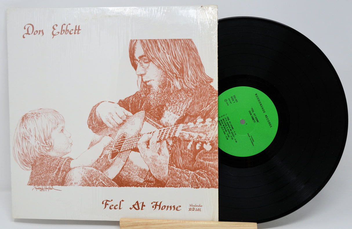 Front cover of Don Ebbett's Feel At Home vinyl album with artistic guitar illustration