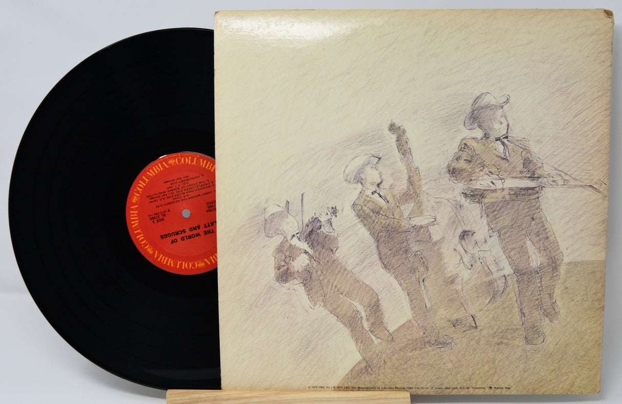 Vinyl record with a cover featuring illustrations of people, on a light gray background.