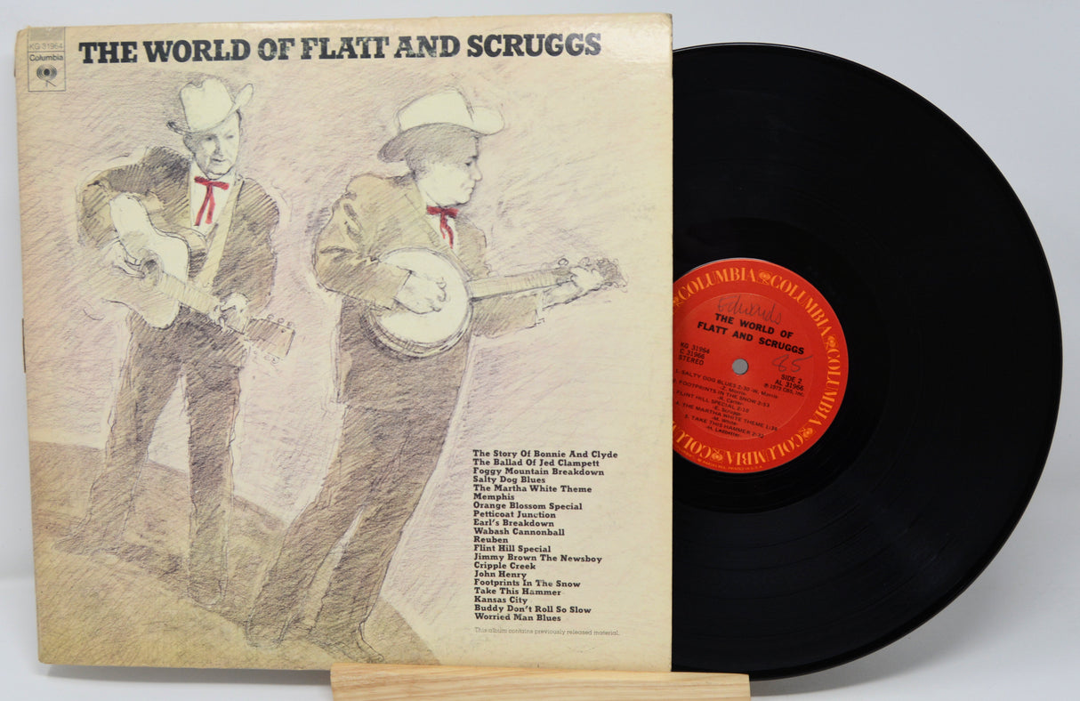 Vinyl record and cover titled 'The World of Flatt and Scruggs' on a white background