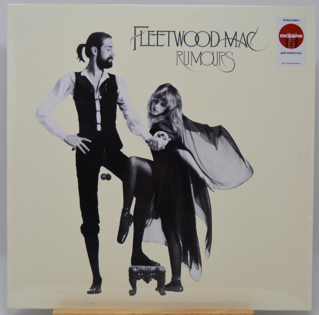 Album cover of Fleetwood Mac's 'Rumours' with black and white illustration of two people.