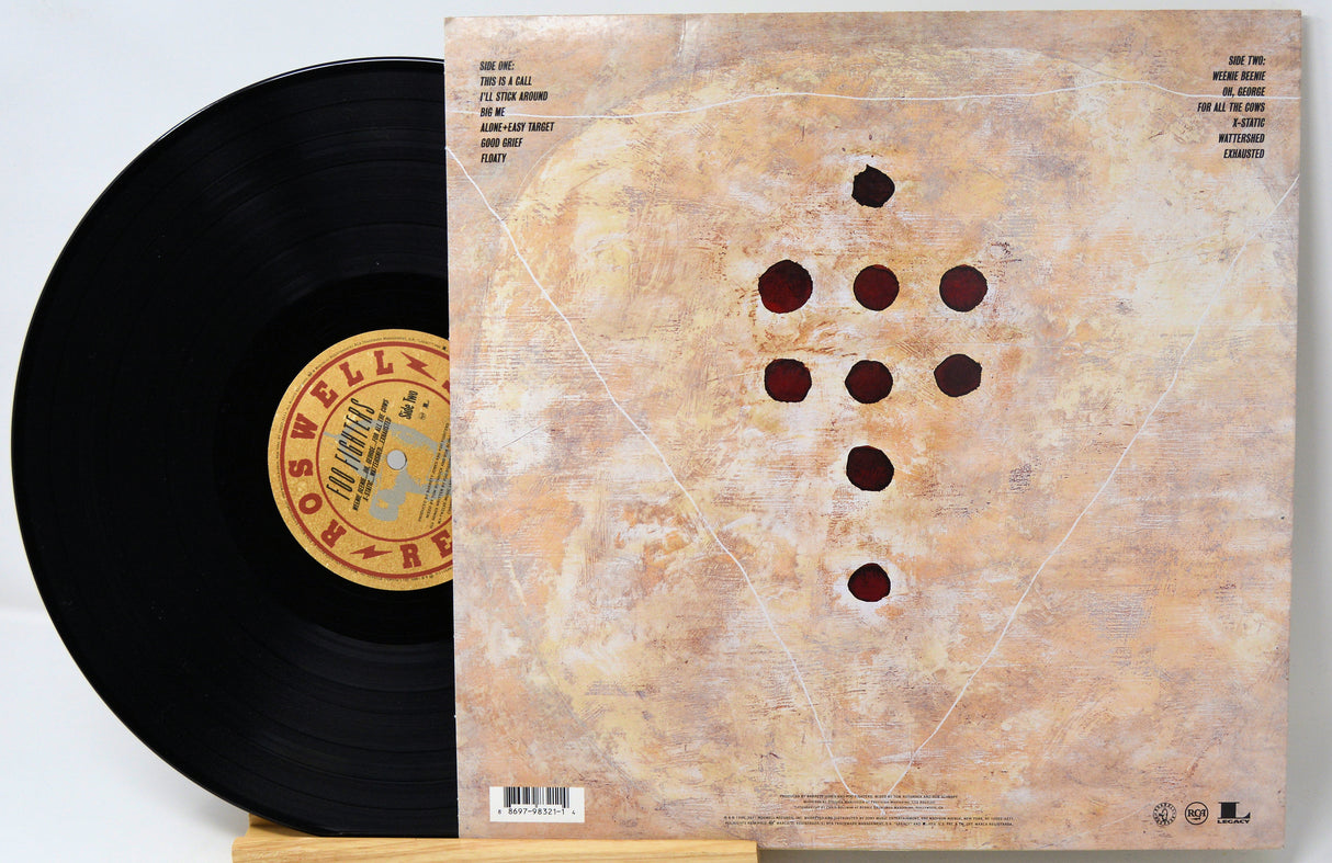 Vinyl cover featuring a brown metal gun