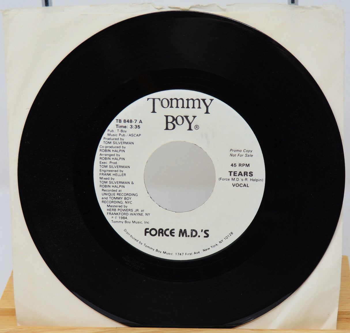 Vinyl record with 'Tommy Boy' label and 'Force M.D.'s' on a white background